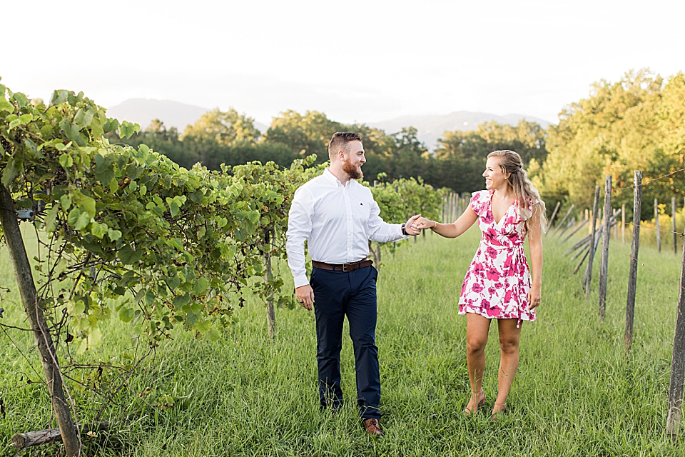 couple in vineyard at Hotel Domestique for engagement session photos