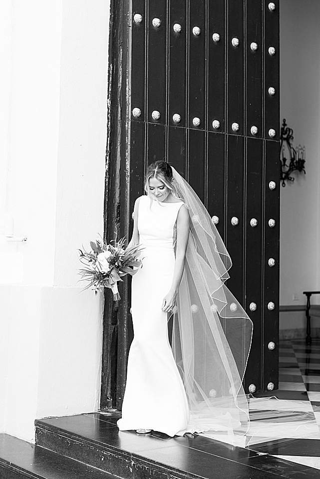 bride looking down in front of door