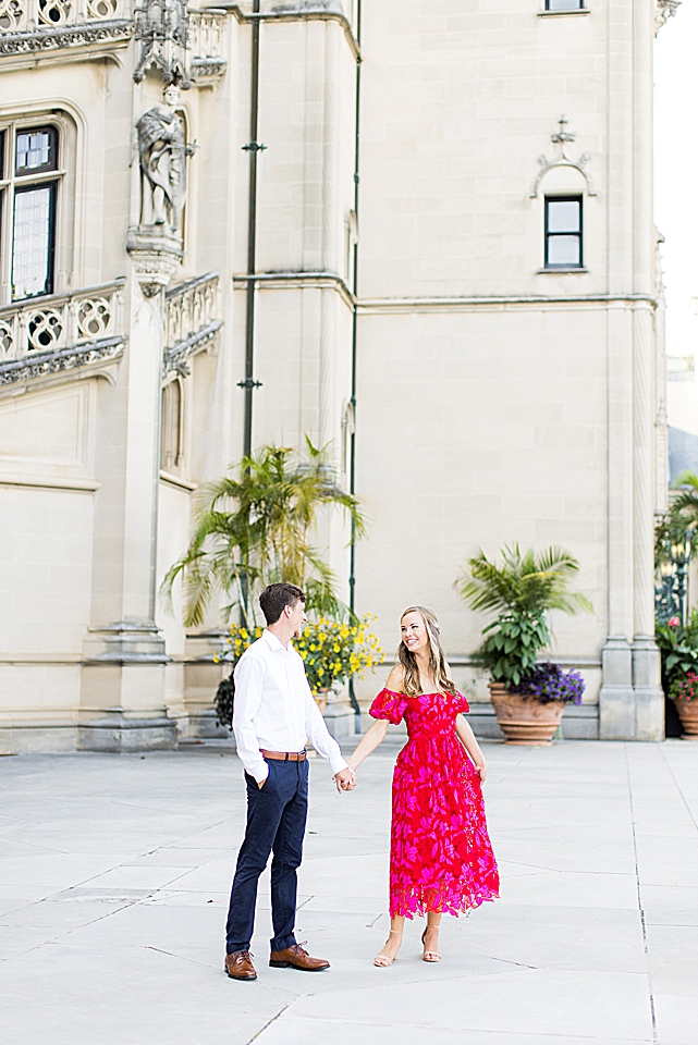 couple standing in front of biltmore for engagement session