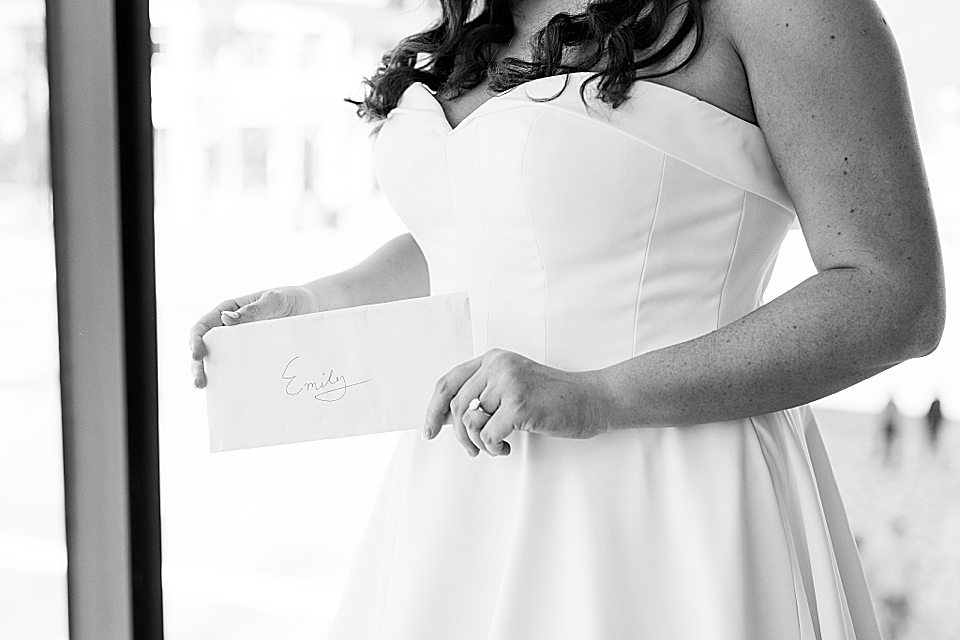 bride holding note