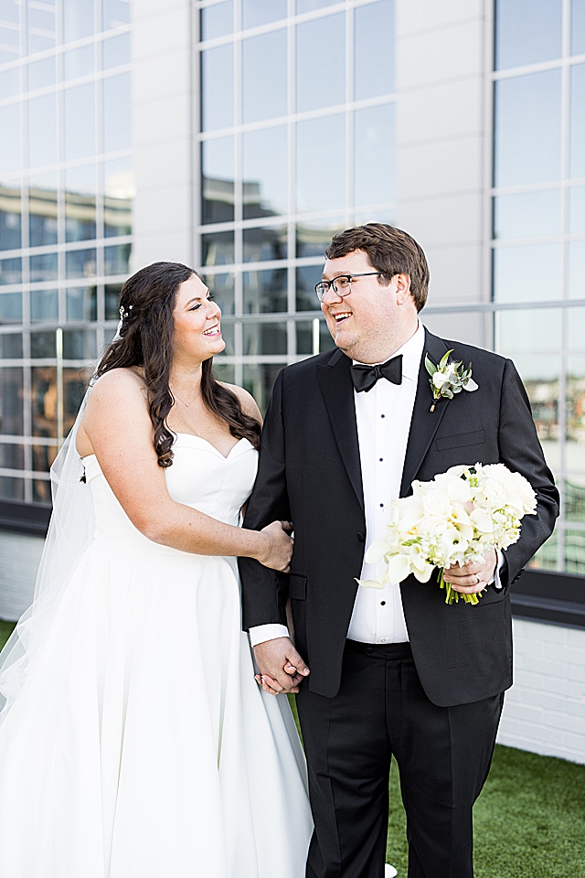 bride and groom in greenville on rooftop at Juniper