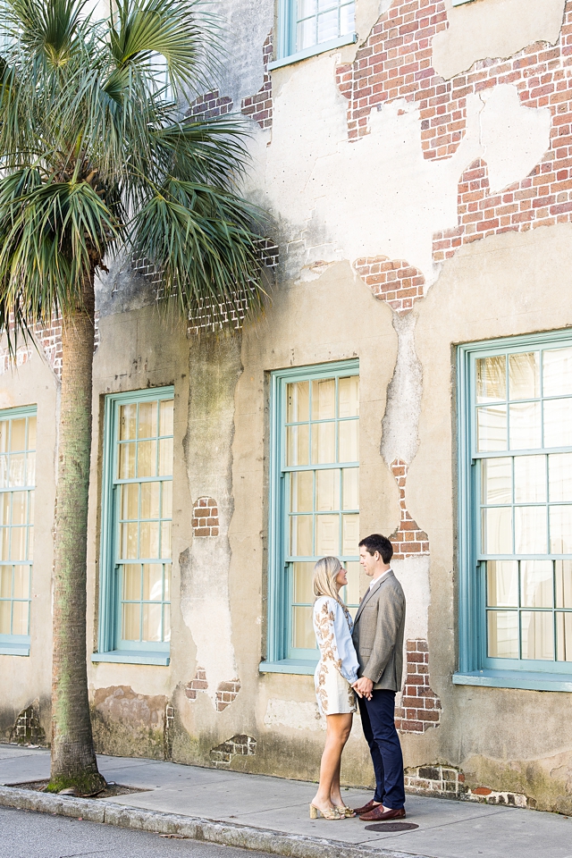 Engagement session charleston sc in front of palm tree